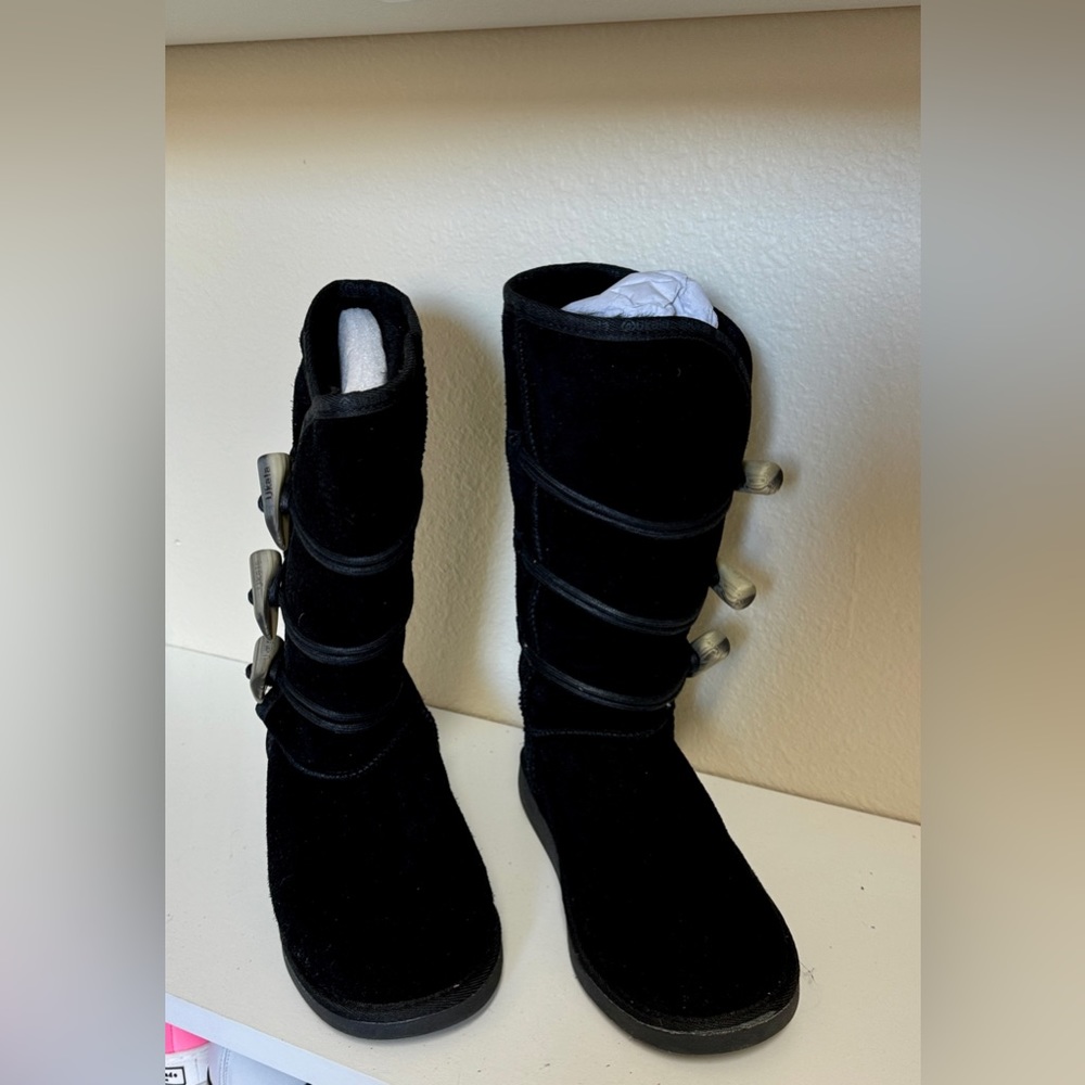 Gently used. Ukala black suede boots, horn detail on each side. Size 6.